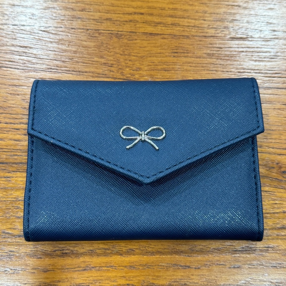 Blue wallet with silver bow